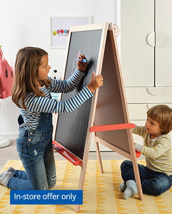 Children playing at an easel. In-store offer only. 