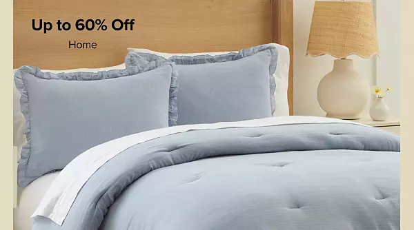 Up to 60% off home. Shop now. A made bed with matching bedspread.
