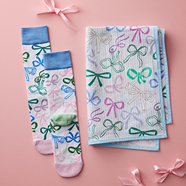 Tea towel and socks with bow pattern.