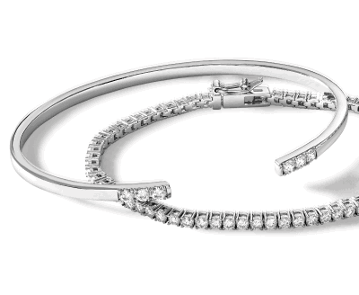 White gold bangle bracelet with diamond accents and diamond tennis bracelet.