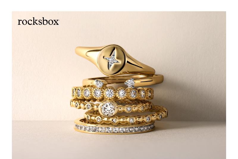 Stack of yellow gold Rocksbox rings featuring diamond accents, a signet ring and textured band designs.