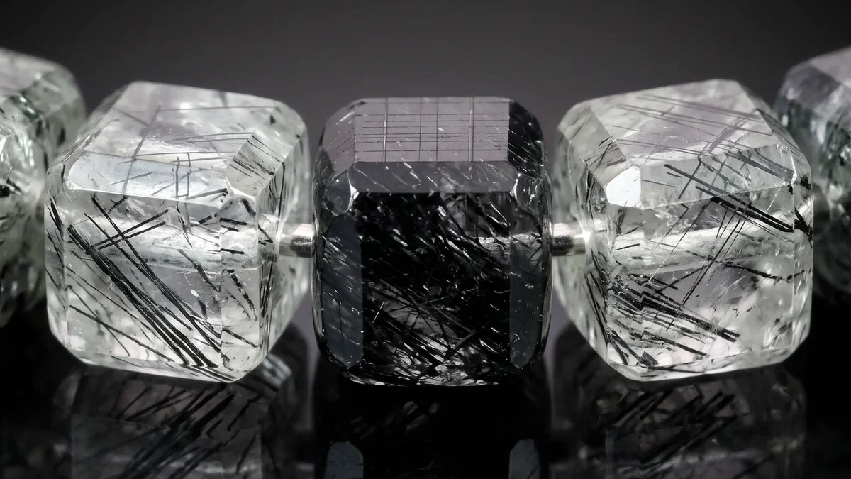 Close-up of black tourmaline crystals inside the Tourmalinated Quartz Cube Bracelet