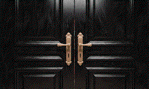 Black doors opening to a TK Maxx store.