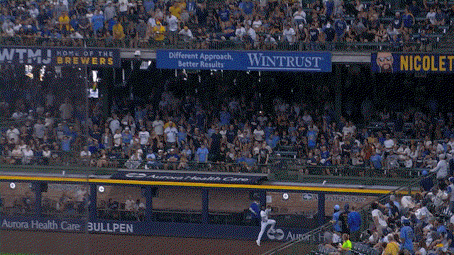 An animated gif of Luis Lara making a leaping catch against the wall
