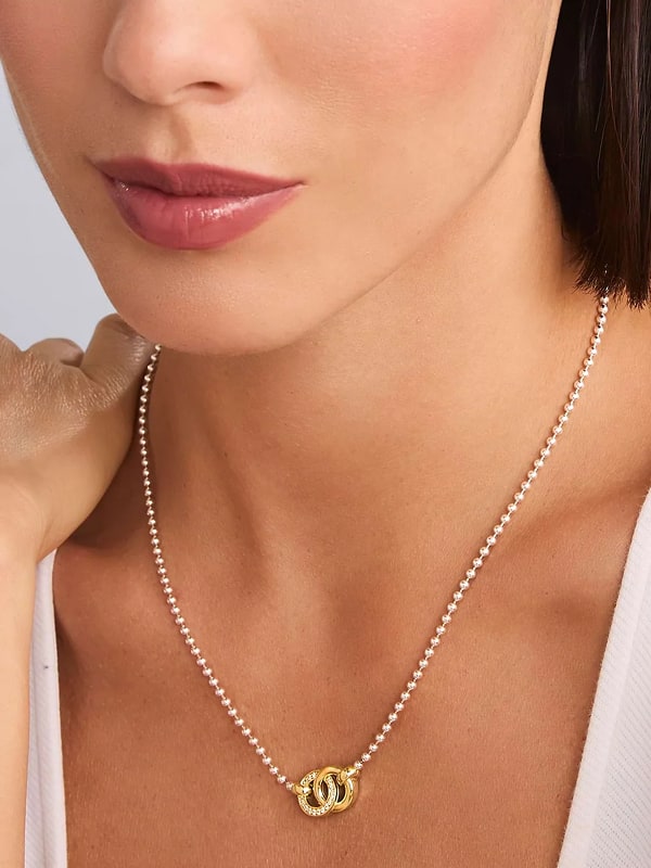 Woman in Interlocking Diamond Necklace
