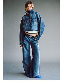 Model wearing blue denim jacket and wide-leg jeans