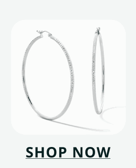 Pair of large, thin sterling silver hoop earrings with a polished finish. Click here to shop now