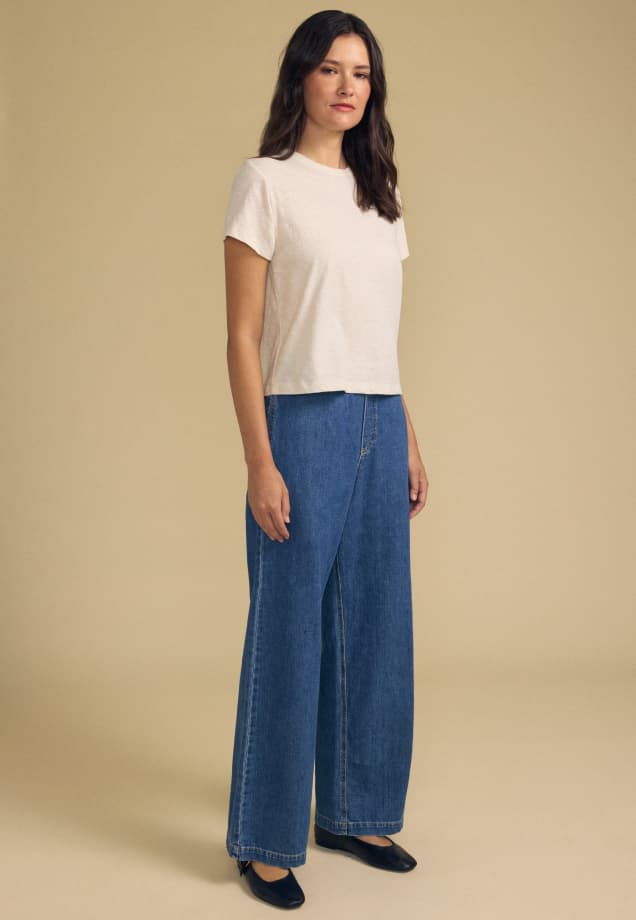 Image shows a model wearing the Syd Jean Pants in Classic.