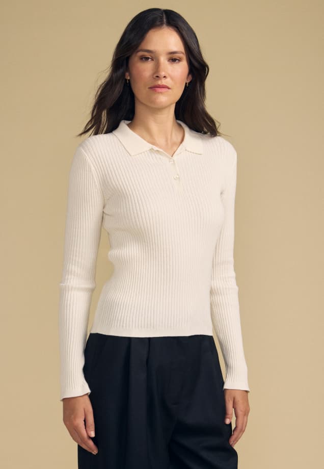 Image shows a model wearing the Frances Sweater Polo in Milk.