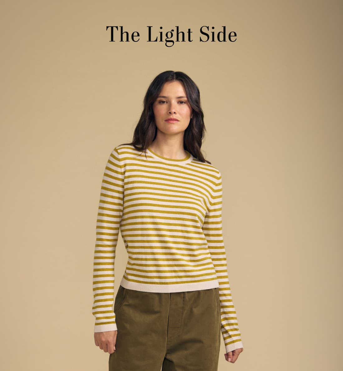 Image shows a model wearing the Roxy Top in Gold. The Light Side
