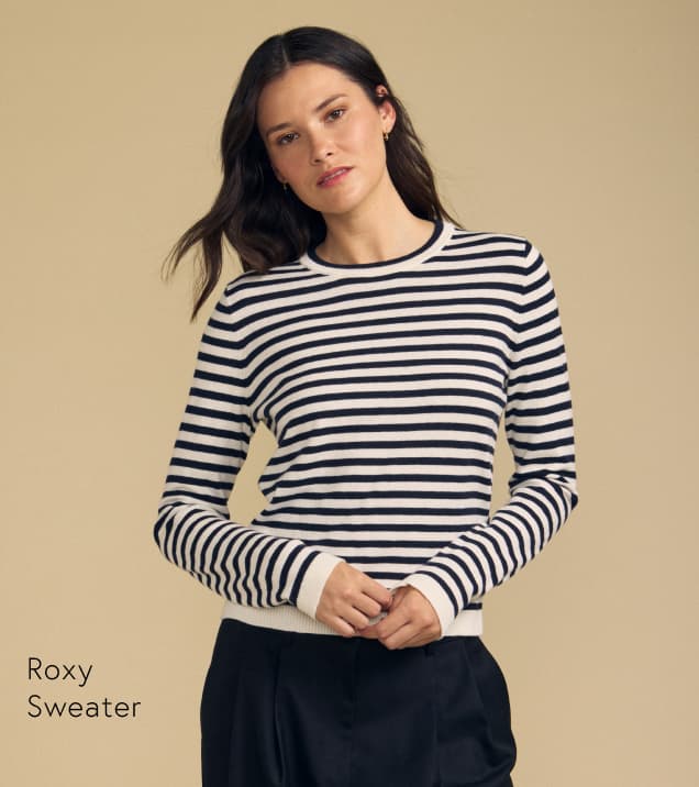 Image shows a model wearing the Roxy Top in Navy.