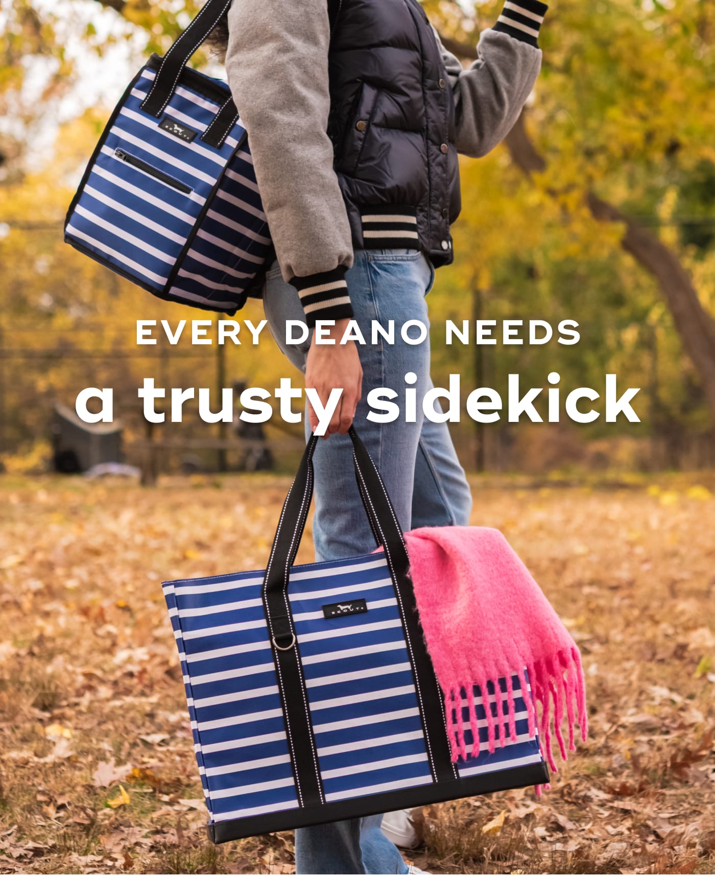 EVERY DEANO NEEDS a trusty sidekick. Woman carrying a blue and white striped SCOUT tote bag with a pink scarf.