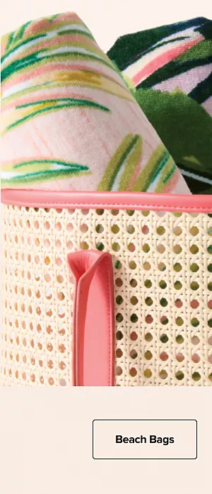 A beach bag with towels and a water bottle. Beach bags. 