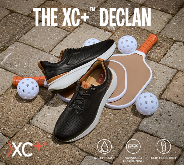 Black XC+™ Declan shoes displayed with pickleball paddles and balls on a court. Text reads: 