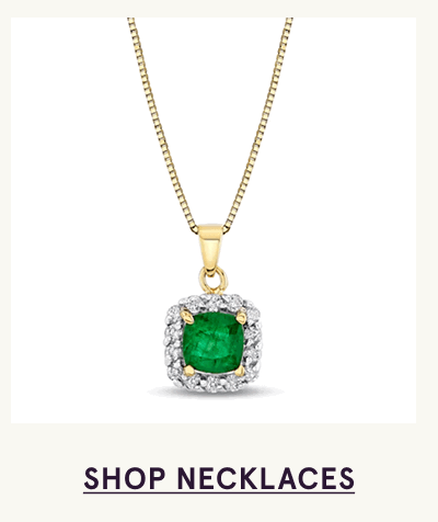 Gold pendant with cushion-cut green emerald gemstone surrounded by halo stones. Click here to shop necklaces