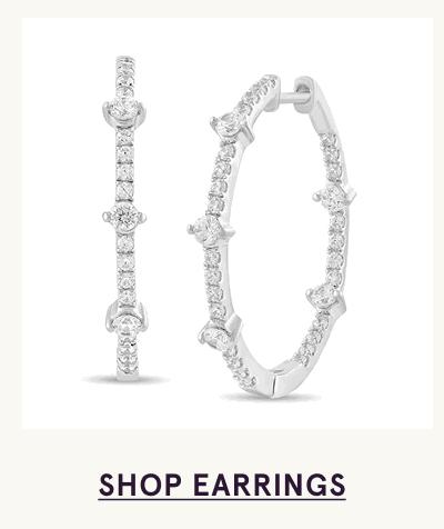 Silver inside-out hoops embellished with mix of round & marquise-cut stones. Click here to shop earrings