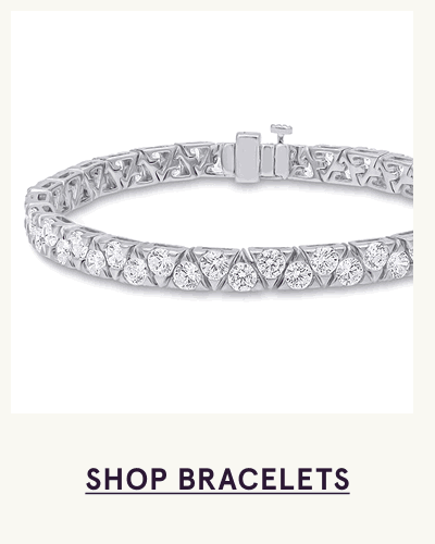 Silver tennis bracelet intricately set with brilliant, closely grouped round diamonds. Click here to shop bracelets