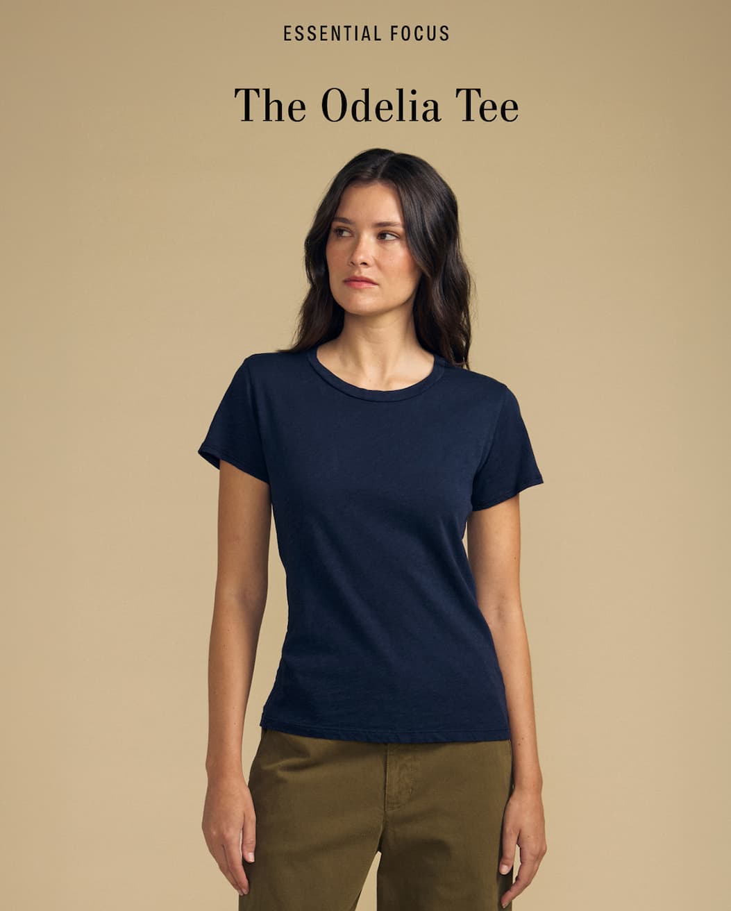Image of model wearing Odelia in Navy. Text reads: Essential Focus. The Odelia Tee.