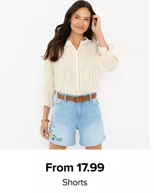 A woman in a top and denim shorts. From 17.99 shorts.