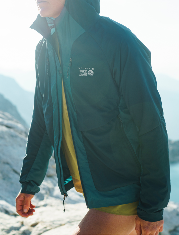 Trail runner in the Women's Kor AirShell™ Hybrid Hooded jacket.