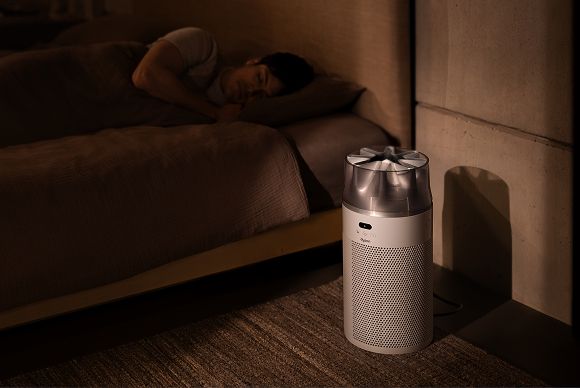Dyson purifier quietly operates next to a sleeping person.