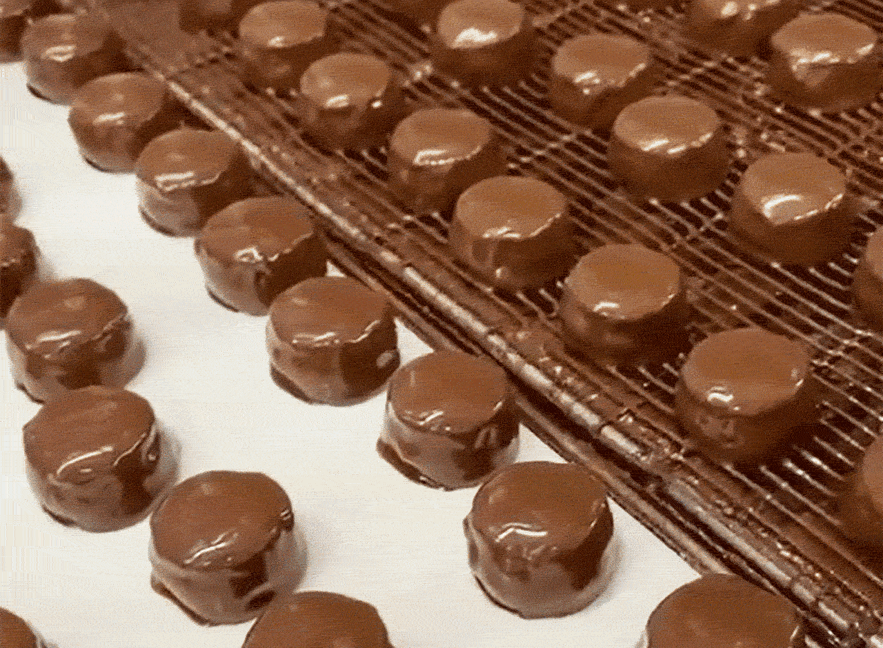 Animated GIF showcasing candies being made inside the See’s Candy Kitchen