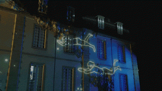 Gif showing animated figures swimming across the illuminated building.