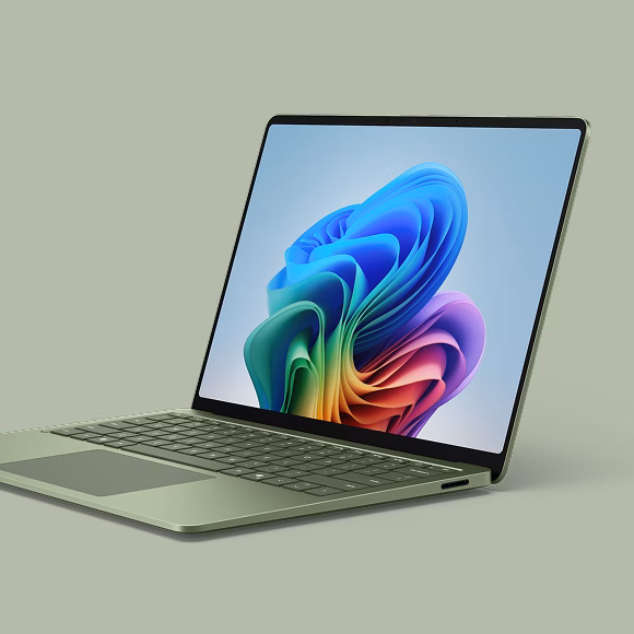 Close up of the Surface Laptop in Jade on a green background.