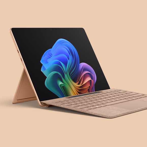 Close up of the Surface Pro in Dune on an orange background.