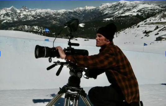 Shane Charlebois filming in mountains