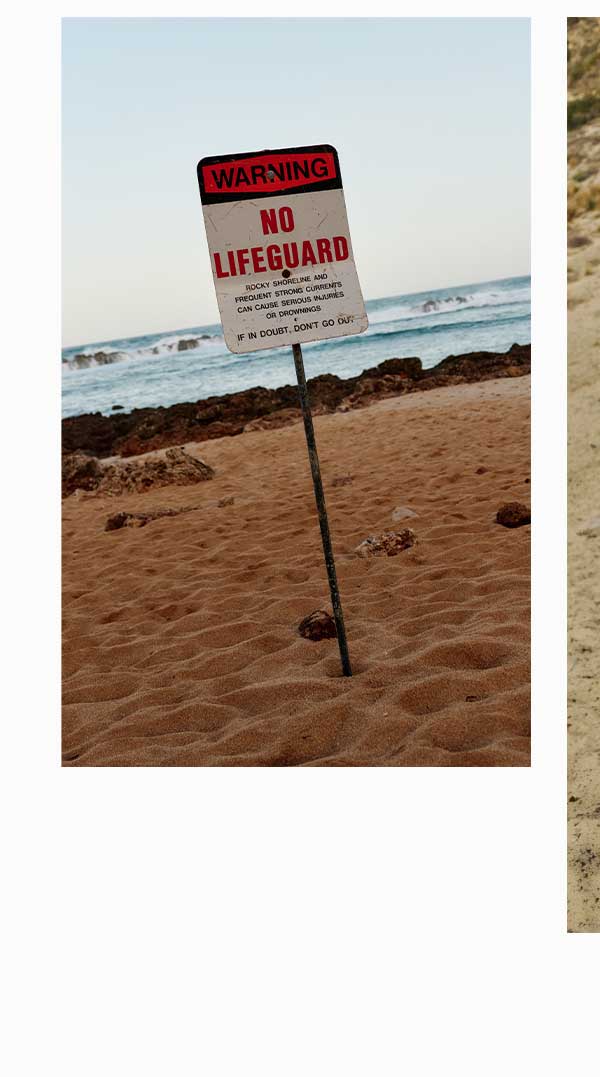 No lifeguard sign on the beach