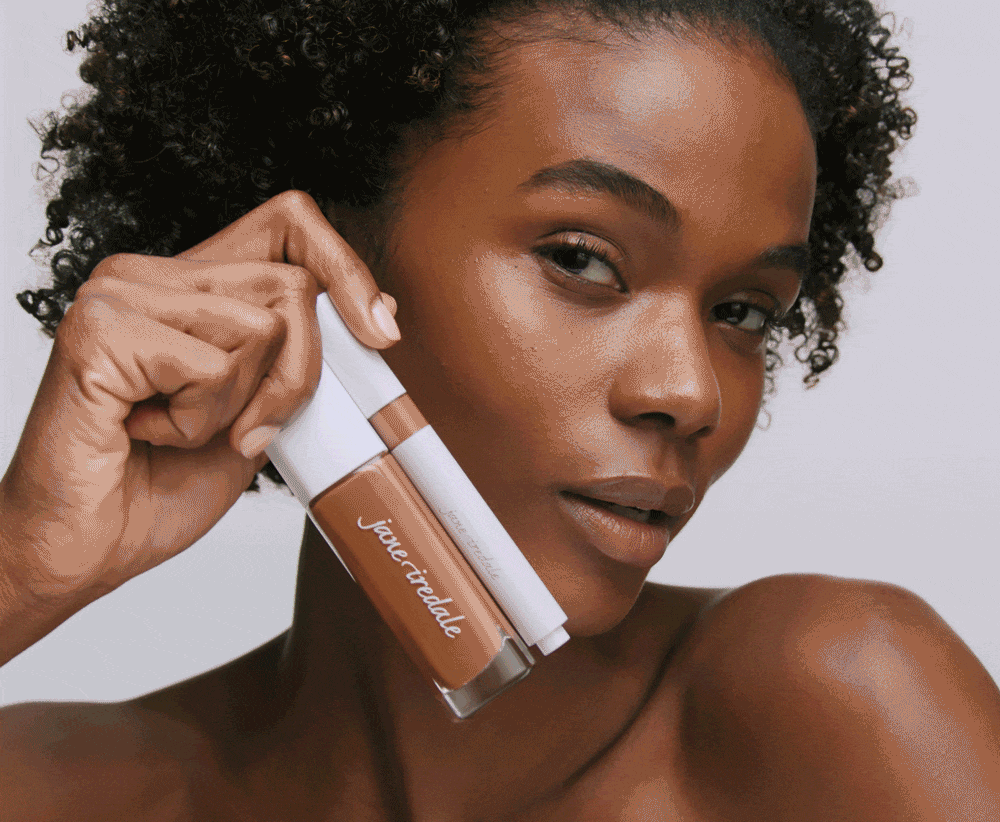 image of model holding Skintuition Foundation and Concealer 