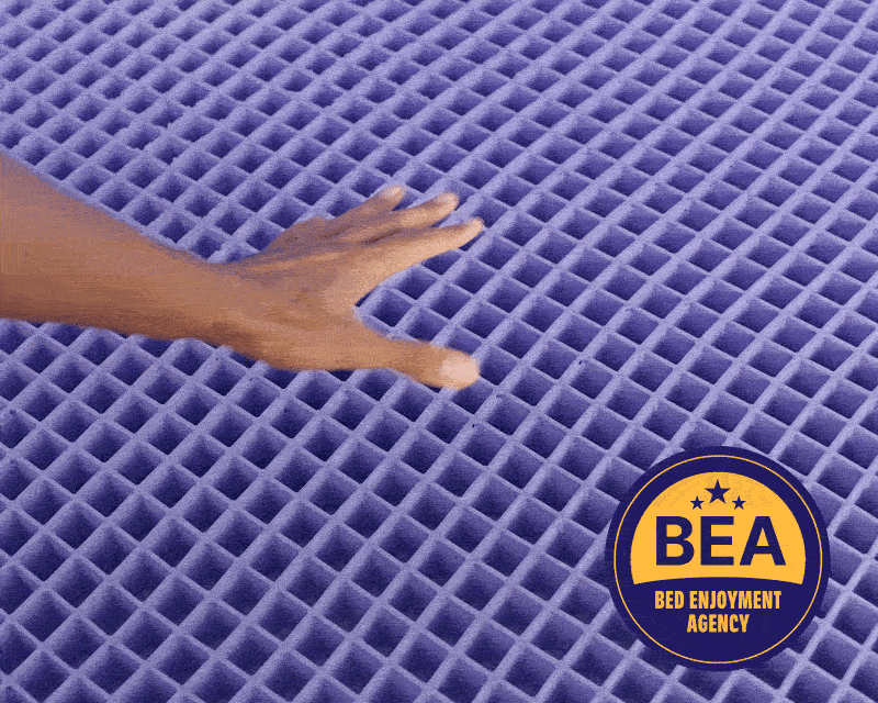 Hand pressing on the mattress grid GIF