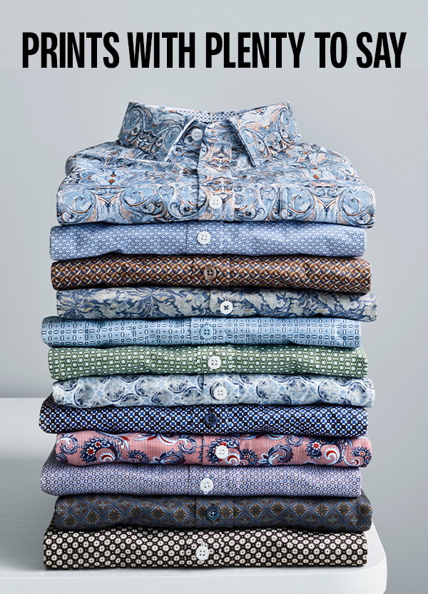 Stack of Logan Printed Shirts in a variety of blue, brown, green, and red prints displayed on a light background. Text reads: 