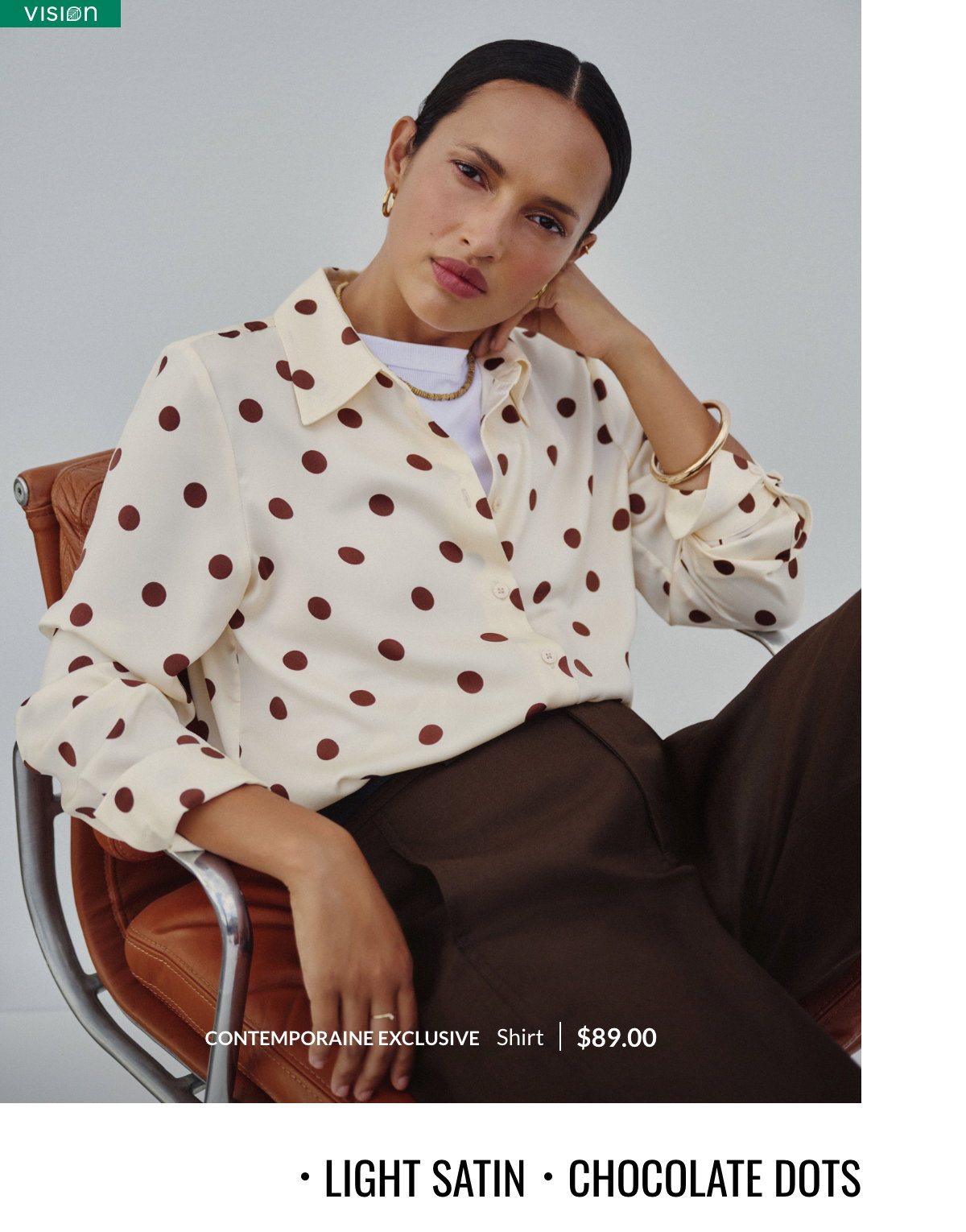 Light satin, chocolate dots. Woman wearing an ivory satiny shirt with brown polka dots, a Contemporaine exclusive design at 89$.