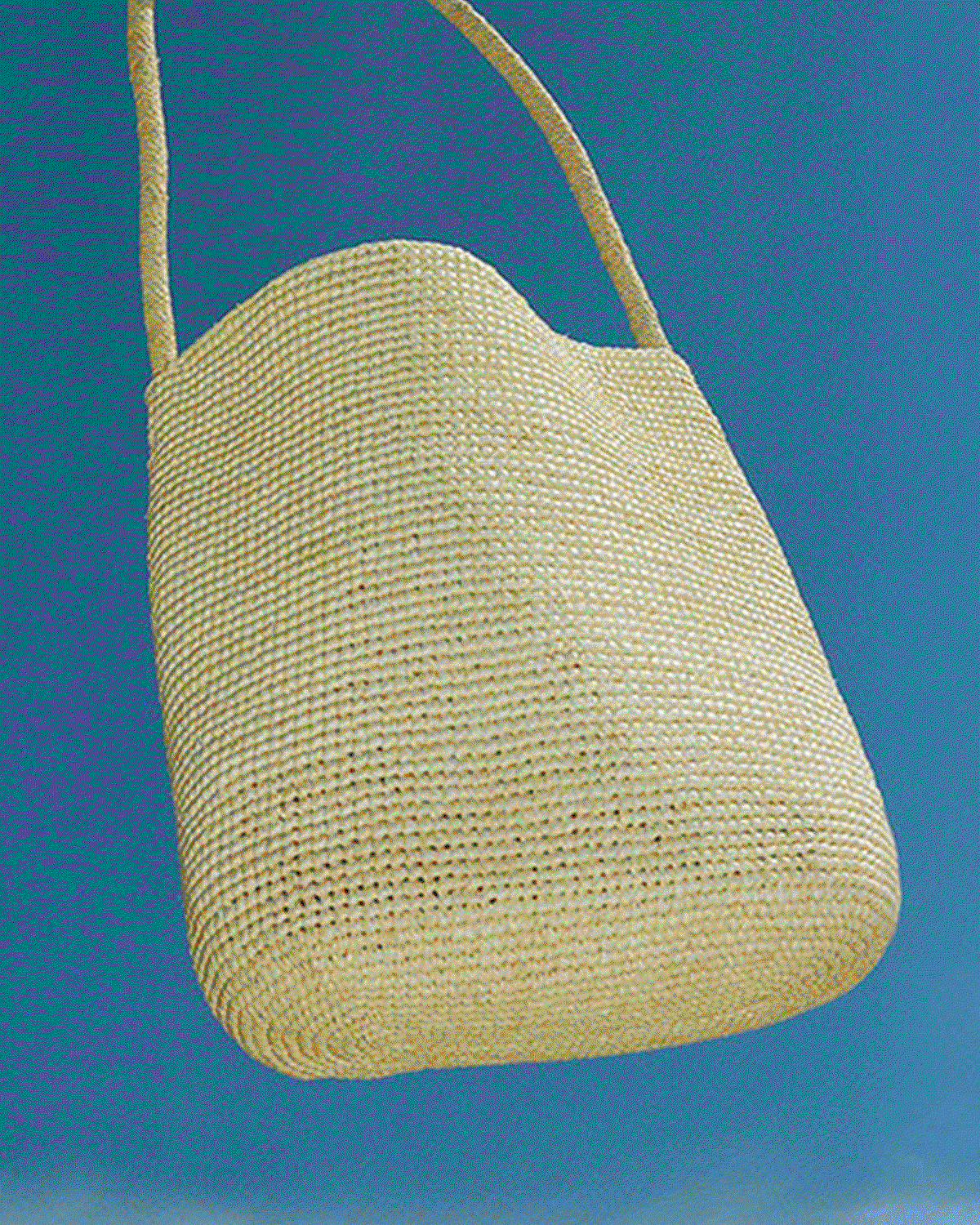 Our summer bag edit is defined by material and craft. Natural woven raffia totes designed to breathe. Soft gathered leather silhouettes that move with wear. Hand-crocheted pieces in partnership with female artisans. Each piece is shaped for summer and designed to last beyond the season.