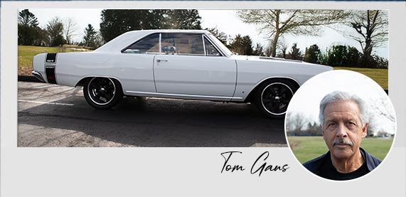 White classic Camaro with an inset photo of Jim & Dominic Rampa.