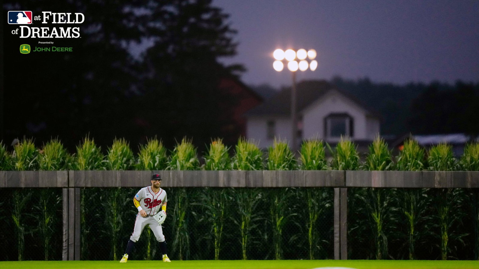 Bryce Harper mans right field in front of the corn, with the farmhouse in the distance