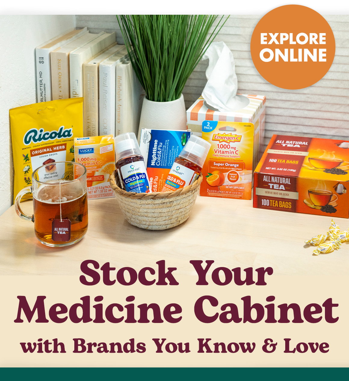 Stock Your Medicine Cabinet with Brands You Know & Love. Image of cough drops, tea, cold medicine, tissues, and Vitamin C drinks on a counter in a house.