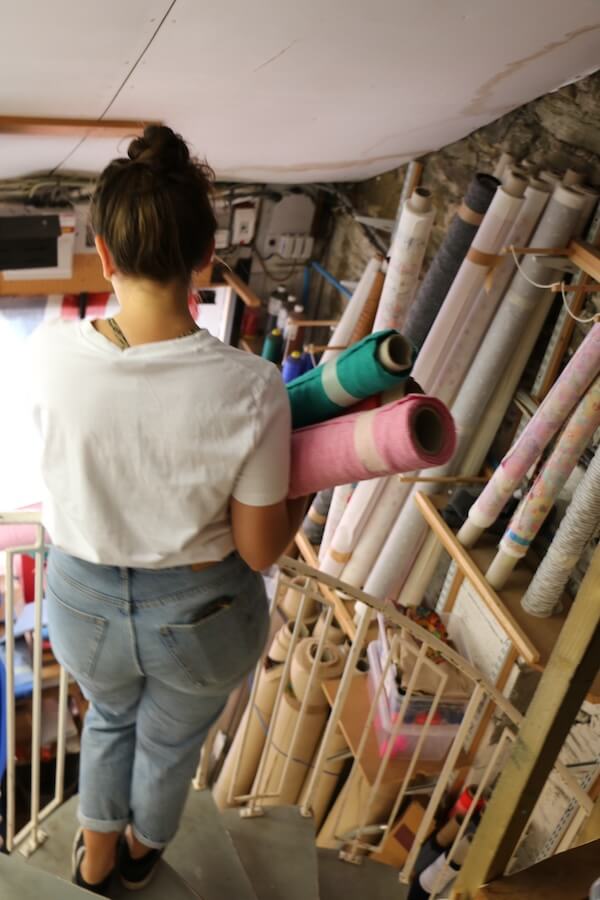 George carrying fabric