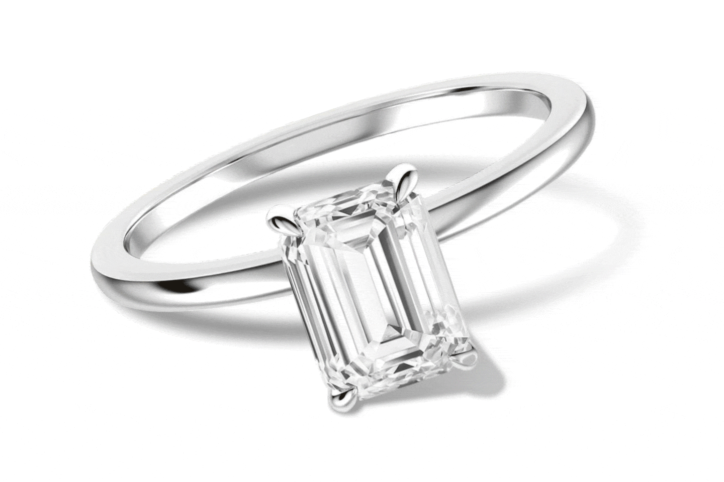 Emerald-cut solitaire ring, marquise diamond ring, and oval diamond rings with pavé-set bands.
