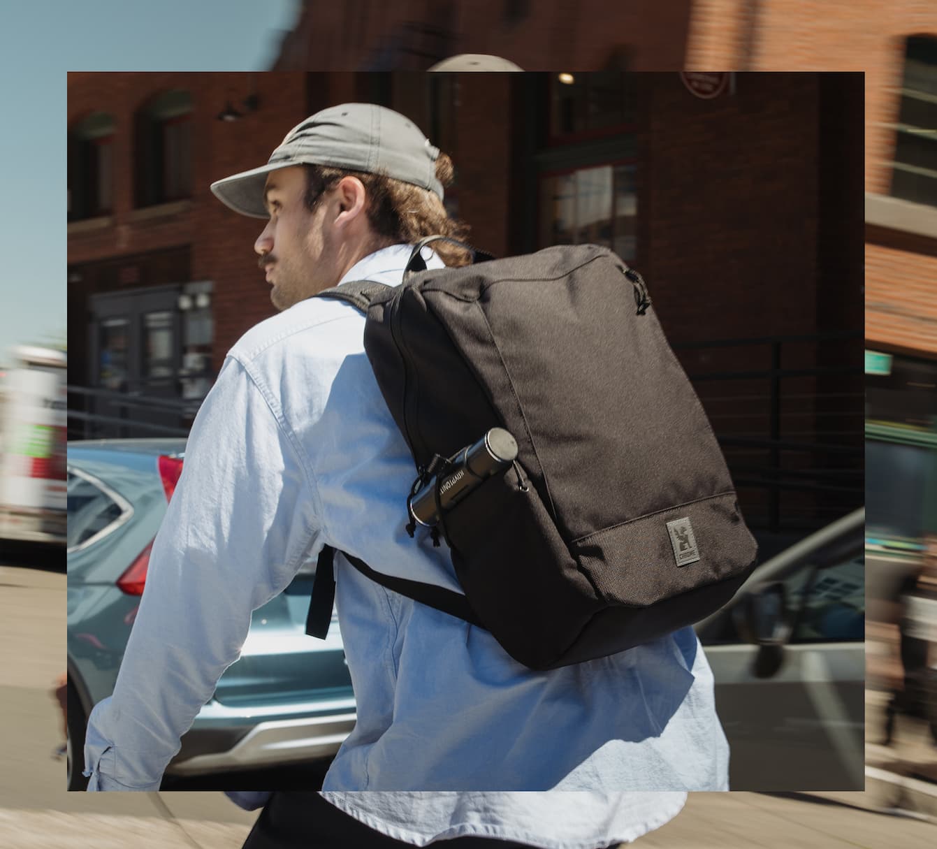 A guy riding a bike wearing the new Recruit 22L Pack