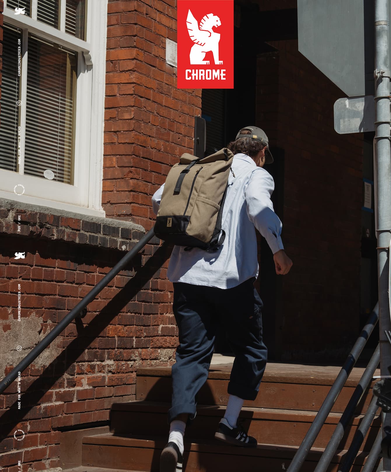 A man running up the stairs wearing a new Initiate 26L Pack