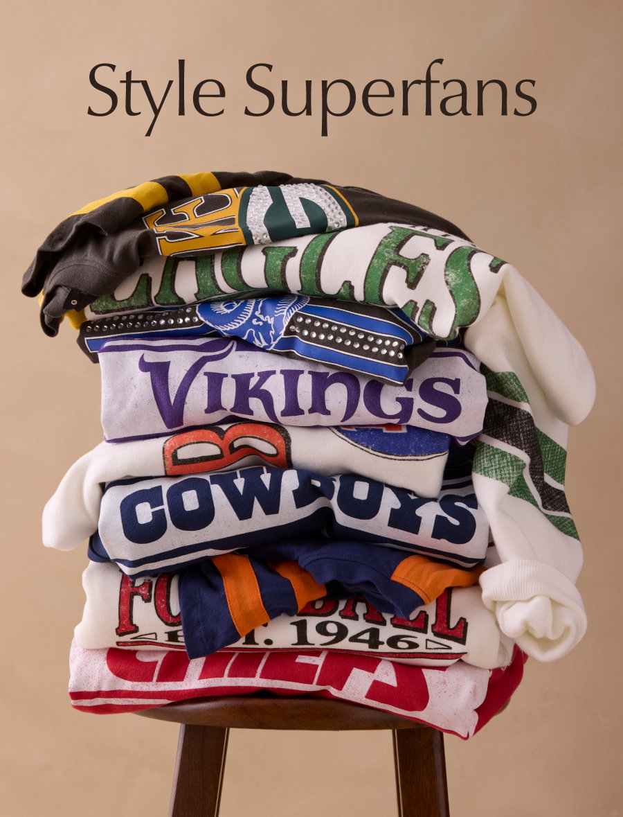 Style Superfans. Image of stack of retro sports team sweaters.