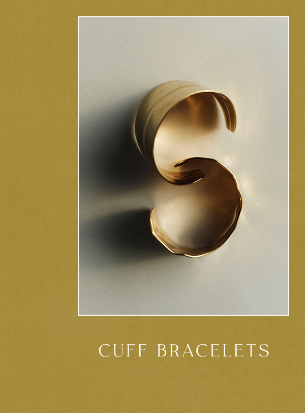 Sculptural gold cuff bracelets arranged in a curved shape on a white card against a mustard yellow background. Text: CUFF BRACELETS.