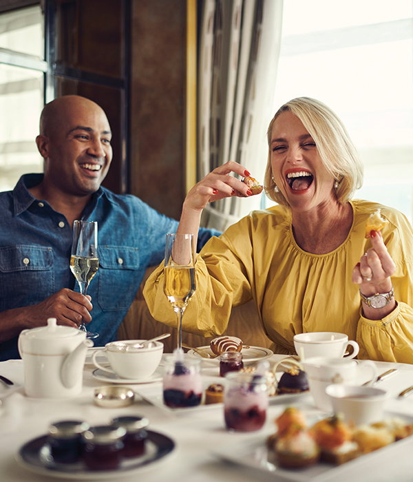 A couple enjoying Champagne Afternoon Tea