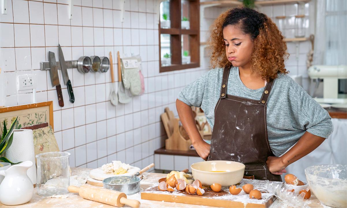 Woman overwhelmed in kitchen