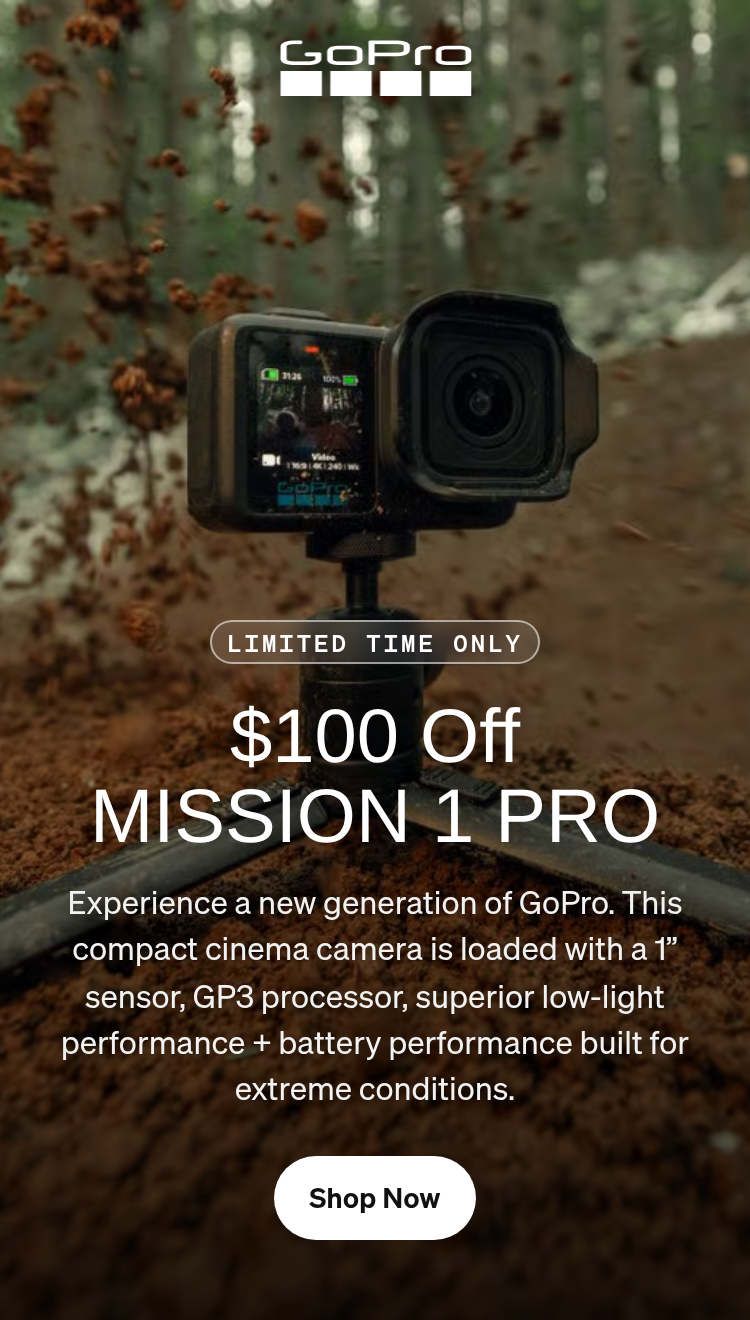 GoPro camera on a tripod capturing dirt spraying on a forest trail.