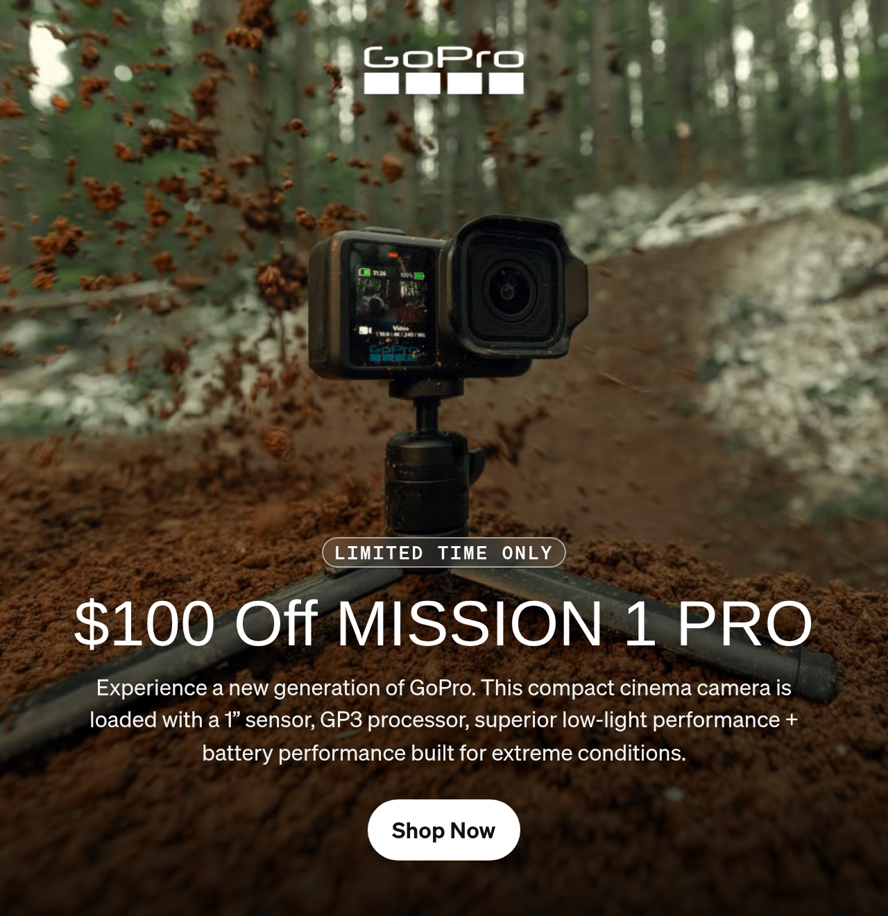 GoPro camera on a tripod capturing dirt spraying on a forest trail.