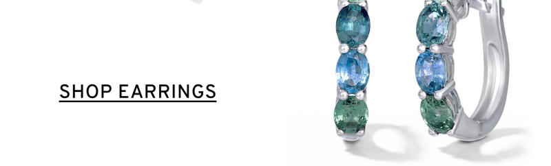 A pair of hoops with green and blue stones set in white gold. Click to Shop Earrings